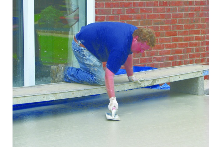 The concrete is floated to produce a smooth floor level.