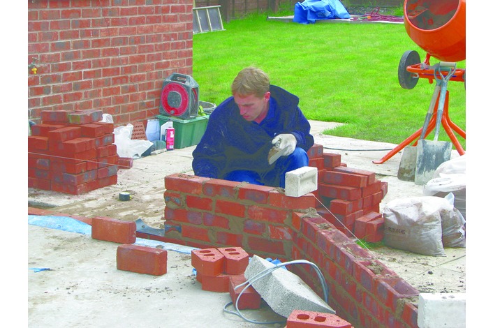 Using bricks to match the existing house brickwork the remaining dwarf walls for the conservatory are constructed in accordance with the base plans.