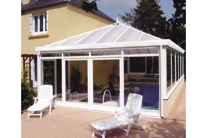 Double hipped Edwardian swimming pool enclosure. Roof is fitted with optional Cornice eaves upgrade.
