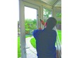 Installing the double glazed sealed units into a French door.