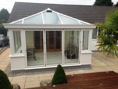  aluminium bifold doors in Livin room conservatory with Cornice fitted