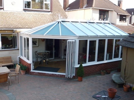 White Victorian Conservatory with bifolding doors